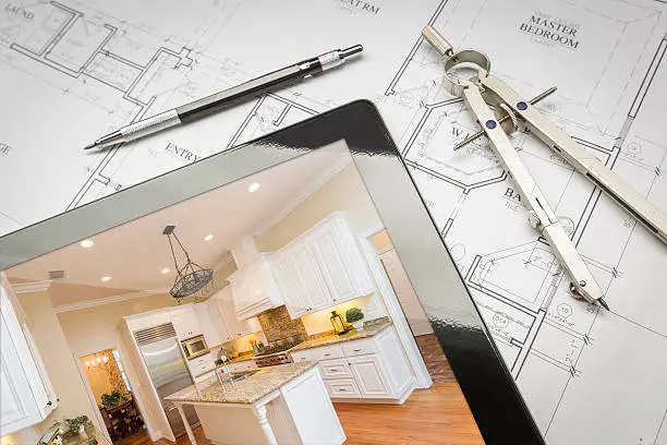 Siding Replacement GRIMESLAND NC 3 Kitchen design plans on a tablet beside architectural blueprints