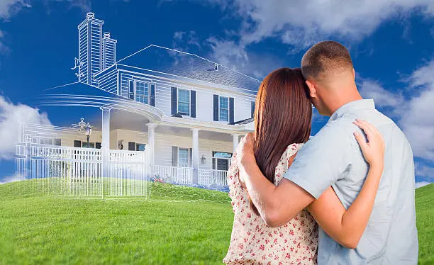 A Step-by-Step Guide: How to Choose the Perfect Lot for Your New Home 5 Couple looking at an outline of their planned new home