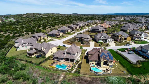 A Step-by-Step Guide: How to Choose the Perfect Lot for Your New Home 2 Aerial view of a neighborhood of large new homes