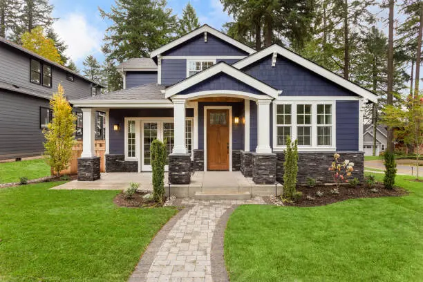 Home 2 New home with a covered entrance and stone columns