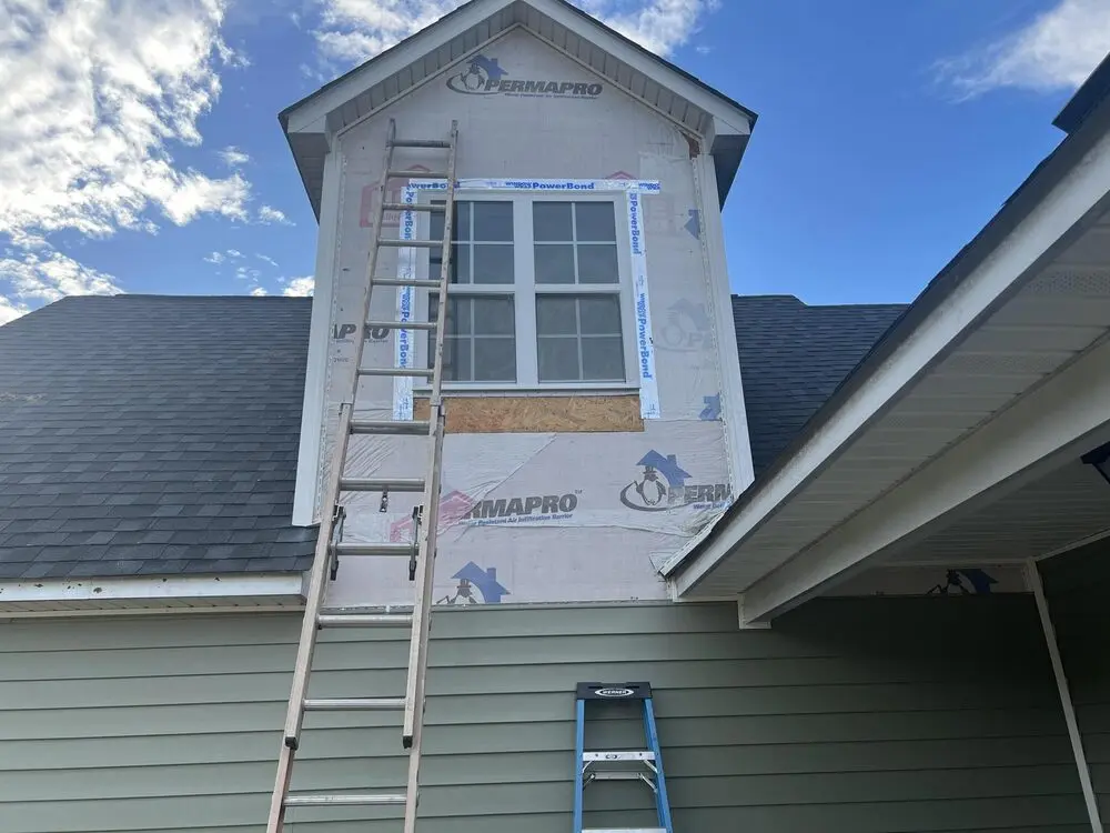 Siding Repair Greenville NC 3 Dormer on a home addition with a ladder against the wall