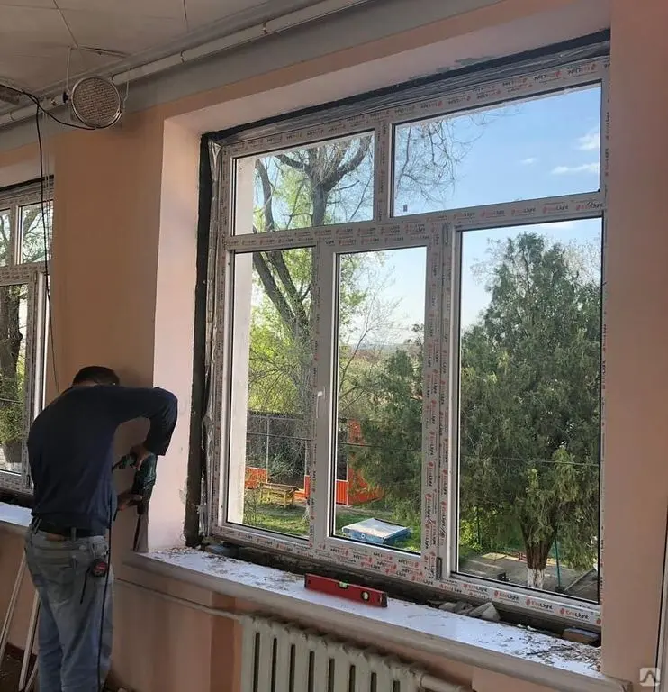 Window Installation & Replacement Greenville NC 3 Contractor installing a large window in a home in Greenville, NC